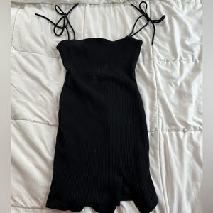Black Princess Polly mini dress with a small slit in a size 2!